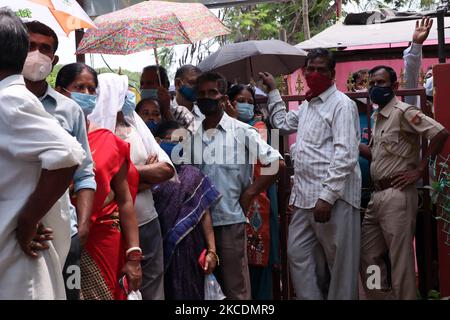 People in queue outside a vaccination centre to get their COVID-19 vaccine, in Guwahati, Assam, India on Friday, 30 April 2021. India enters the third phase of its coronavirus vaccination program it intends to vaccinate all those aged above 18 years from May 1 in the country. (Photo by David Talukdar/NurPhoto) Stock Photo