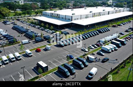 May 1, 2021 - Orlando, Florida, United States - In this aerial view from a drone, delivery vans are seen parked at an Amazon last-mile delivery facility on May 1, 2021 in Orlando, Florida. Amazon announced that it will hold it annual two-day Prime Day shopping event in its second quarter, rather than July, to boost spending in what is typically a slower time for retail sales. (Photo by Paul Hennessy/NurPhoto) Stock Photo