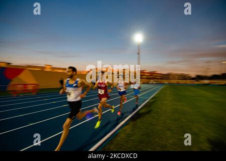 Athletes during the 10,000 meters race at the National Championships in the Mario Saverio Cozzoli stadium in Molfetta on May 2, 2021. In Molfetta, the best Italian male and female athletes compete at the absolute and promising Italian Championships of 10,000 meters, in the new stadium named after Mario Saverio Cozzoli, formerly home to the Tricolor winter launches in February (Photo by Davide Pischettola/NurPhoto) Stock Photo