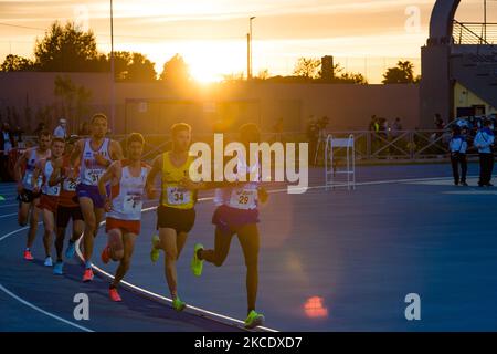 Athletes during the 10,000 meters race at the National Championships in the Mario Saverio Cozzoli stadium in Molfetta on May 2, 2021. In Molfetta, the best Italian male and female athletes compete at the absolute and promising Italian Championships of 10,000 meters, in the new stadium named after Mario Saverio Cozzoli, formerly home to the Tricolor winter launches in February (Photo by Davide Pischettola/NurPhoto) Stock Photo