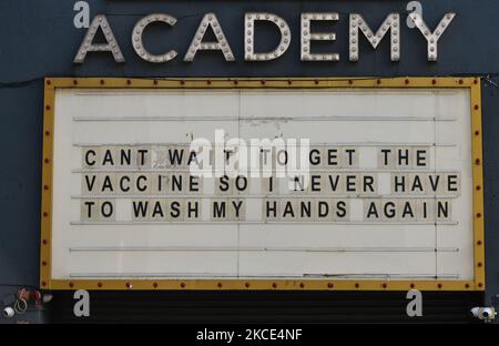 An uplifting notice on the message board reading 'Can't wait to get the vaccine, so I never have to wash my hands again' seen outside the Academy building in Dublin city center during the final days of the COVID-19 lockdown. On Friday, 7 May 2021, in Dublin, Ireland. (Photo by Artur Widak/NurPhoto) Stock Photo