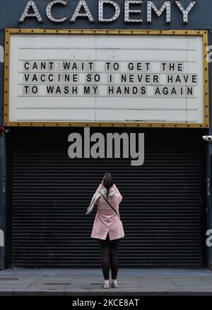 An uplifting notice on the message board reading 'Can't wait to get the vaccine, so I never have to wash my hands again' seen outside the Academy building in Dublin city center during the final days of the COVID-19 lockdown. On Sunday, 9 May 2021, in Dublin, Ireland. (Photo by Artur Widak/NurPhoto) Stock Photo