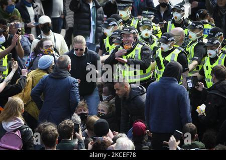 Police officers clash with protestors who are blocking a UK home office immigration enforcement van after an attempted raid was carried out in the morning in Kenmure Street in Pollokshields on May 13, 2021 in Glasgow, Scotland. (Photo by Ewan Bootman/NurPhoto) Stock Photo