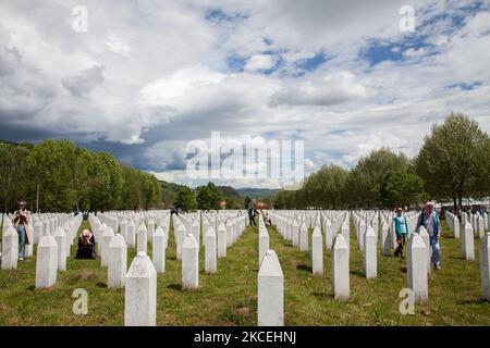 A Bosnian Muslim woman, survivor of the 1995 Srebrenica massacre, walks between tombstones at the Potocari memorial cemetery, a village just outside Srebrenica, Bosnia and Herzegovina, on May 15, 2021. Shaleed, the day of martyrs in Muslim tradition, is celebrated on the second day after Ramadan. The Potocari Memorial is a meeting place for thousands of Bosniaks from Srebrenica and the whole country who come to pray and pay tribute to their loved ones killed in July 1995. (Photo by Jose Antonio Sanchez/NurPhoto) Stock Photo