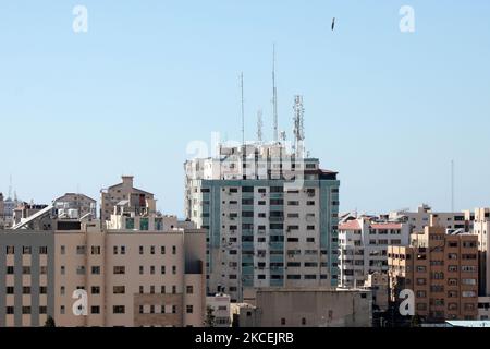 An air bomb hits the Jala Tower during an Israeli airstrike in Gaza city controlled by the Palestinian Hamas movement, on May 15, 2021. - Israeli air strikes pounded the Gaza Strip, killing 10 members of an extended family and demolishing a key media building, while Palestinian militants launched rockets in return amid violence in the West Bank. Israel's air force targeted the 13-floor Jala Tower housing Qatar-based Al-Jazeera television and the Associated Press news agency. (Photo by Majdi Fathi/NurPhoto) Stock Photo