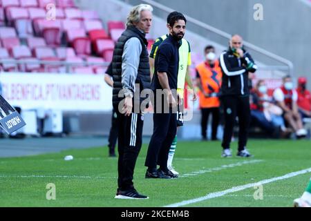 Sporting's head coach Ruben Amorim (R ) and Benfica's head coach Jorge Jesus looks on during the Portuguese League football match between SL Benfica and Sporting CP at the Luz stadium in Lisbon, Portugal on May 15, 2021. (Photo by Pedro FiÃºza/NurPhoto) Stock Photo