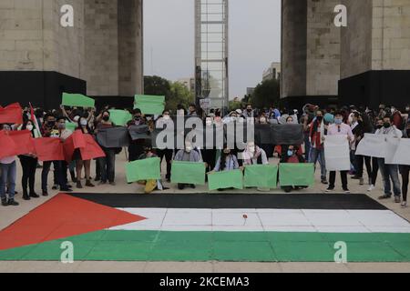 Human rights organizations protest in front of a Palestinian flag painted under the Monument to the Revolution in Mexico City to demonstrate against the bombings carried out by the Israeli army in recent days against the Palestinian territories in the Gaza Strip. On May 15, 2021 in Mexico City, Mexico. (Photo by Gerardo Vieyra/NurPhoto) Stock Photo