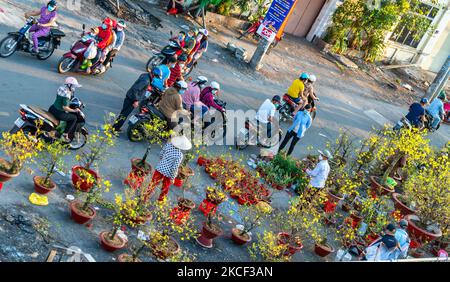 Bustle of buying flowers at flower market, locals buy flowers for decoration purpose the house on Lunar New Year in Ho Chi Minh City, Vietnam. Stock Photo