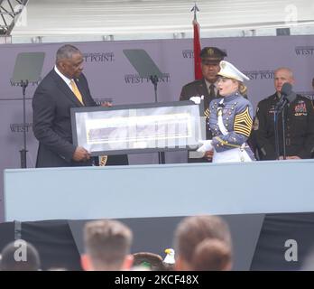 U.S. Secretary of Defense Lloyd J. Austin III is given a gift by West Point graduate during the 2021 West Point Commencement Ceremony on May 22, 2021 in West Point, New York. (Photo by Selcuk Acar/NurPhoto) Stock Photo