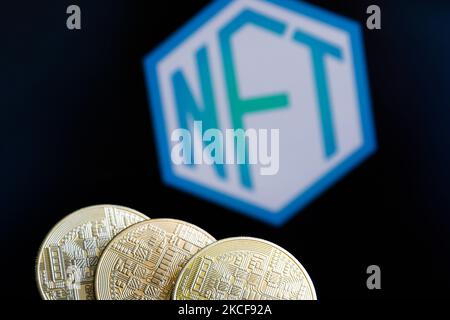 Representation of cryptocurrencies and non-fungible token - NFT logo displayed on a screen are seen in this illustration photo taken in Krakow, Poland on May 26, 2021. (Photo by Jakub Porzycki/NurPhoto) Stock Photo
