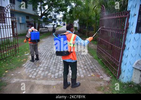 Municipal workersÂ during Â SanitizationÂ a Covid vaccination centre in Nagaon district in the northeastern state of Assam, India on May 29,2021 (Photo by Anuwar Hazarika/NurPhoto) Stock Photo