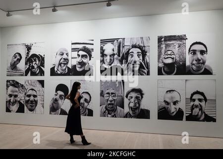 LONDON, UNITED KINGDOM - JUNE 02, 20201: A woman looks at 'Face 2 Face' (2006-2007) by JR (French, born 1983) during a press view for the 'JR: Chronicles' exhibition (04 June - 03 October 2021) at Saatchi Gallery on June 02, 2021 in London, England. 'JR: Chronicles', curated by Sharon Matt Atkins and Drew Sawyer from the Brooklyn Museum, is the largest solo museum exhibition to date of the internationally recognised French artist JR, featuring some of his most iconic projects from the past fifteen years. (Photo by WIktor Szymanowicz/NurPhoto) Stock Photo