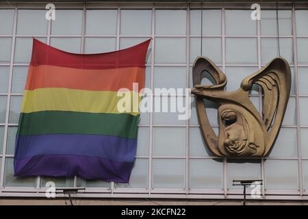 View of a LGBTTTIQA pride flag placed outside the Mexican Social Security Institute (IMSS) facilities in Mexico City during the COVID-19 health emergency and the yellow epidemiological traffic light in the capital. (Photo by Gerardo Vieyra/NurPhoto) Stock Photo