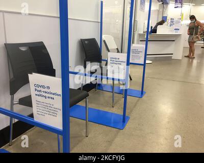 Woman registers for a COVID-19 vaccine at a Walmart store Toronto, Ontario, Canada on June 10, 2021. (Photo by Creative Touch Imaging Ltd./NurPhoto) Stock Photo