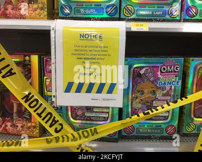 Yellow caution tape blocks aisles with goods not allowed to be sold at a Walmart store during the novel coronavirus (COVID-19) pandemic in Toronto, Ontario, Canada on June 10, 2021. Due to Ontario's COVID-19 state of emergency and stay-at-home order the Province of Ontario has forced big-box stores to enact new measures to block off items deemed non-essential by the provincial government. Big box retailers can remain open but only sell essential goods such as groceries, household supplies and pharmacy items. (Photo by Creative Touch Imaging Ltd./NurPhoto) Stock Photo