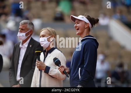 President of the French Tennis Federation (FFT) and former player Gilles Moretton (L) and former tennis player Martina Navratilova (R) congratulate Czech Republic's Barbora Krejcikova (C) as she receives the Suzanne Lenglen Cup after winning the women's singles final tennis match against Russia's Anastasia Pavlyuchenkova during the trophy ceremony on Day 14 of The Roland Garros 2021 French Open tennis tournament in Paris on June 12, 2021. (Photo by Mehdi Taamallah / Nurphoto) (Photo by Mehdi Taamallah/NurPhoto) Stock Photo