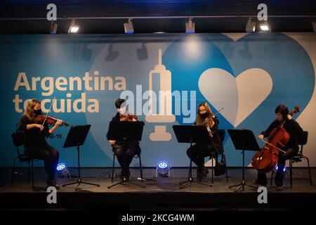 An orchestra plays inside the CCK Cultural Centre (Centro Cultural Kirchner) during vaccination of members of the armed forces, in Buenos Aires, Argentina June 15, 2021. (Photo by Matías Baglietto/NurPhoto) Stock Photo
