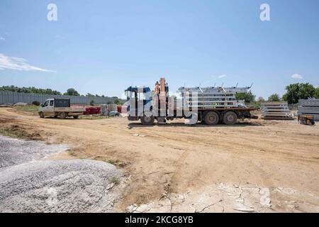 Work in progress, constuction of the new fence. Greece is reinforcing the Greek Turkish borders with personnel, cameras, drones, heavy vehicles, FRONTEX officers but also with a 5 meter tall fence. The fence is actually a concrete filled, a construction for at least 40KM, a long coverage in the wetlands of Evros river (Meric in Turkish), Greece's river border with Turkey. EU is supporting the border fortification financially. Asylum seekers, migrants and refugees used Evros as an entrance point to Europe, while in March 2020 a huge wave of thousands of people tried to cross the borders. Poros  Stock Photo