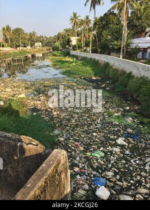 Sewage and rubbish clog a waterway in Anayara, Pattom, Thiruvananthapuram (Trivandrum), Kerala, India on February 10, 2020. (Photo by Creative Touch Imaging Ltd./NurPhoto) Stock Photo