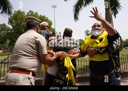 Police officers detain activists of the Tibetan Youth Congress as they shouts slogans during a protest outside the Chinese embassy, against the 100th anniversary of the founding of the Chinese Communist Party (CCP) in New Delhi, India on July 1, 2021. (Photo by Mayank Makhija/NurPhoto) Stock Photo