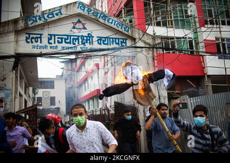 Student cadre burns effigy of Prime Minister KP Sharma Oli during a Protest against the dissolution of parliament in Kathmandu, Nepal on July 1, 2021. (Photo by Rojan Shrestha/NurPhoto) Stock Photo