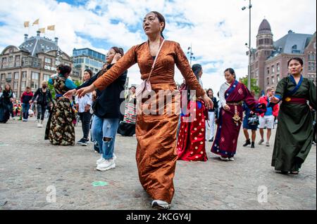 Tibetan people are dancing traditional Tibetan music, during the Dalai Lama 86th birthday celebration in Amsterdam, on July 6th, 2021. (Photo by Romy Arroyo Fernandez/NurPhoto) Stock Photo