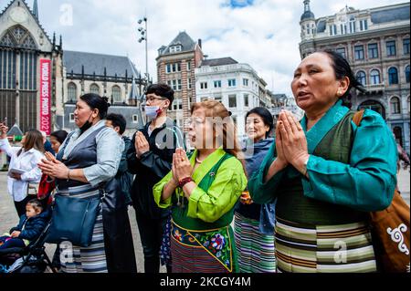 Tibetan people gathered at the Dam Square is praying, during the Dalai Lama 86th birthday celebration in Amsterdam, on July 6th, 2021. (Photo by Romy Arroyo Fernandez/NurPhoto) Stock Photo