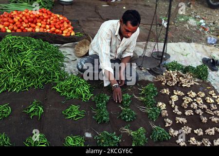 Vegetable vender prepares for customers at the Shaniwaar Subzi Bazaar, which is the largest fruit and vegetable market in the Indian city of Nagpur, Maharashtra, India. (Photo by Creative Touch Imaging Ltd./NurPhoto) Stock Photo