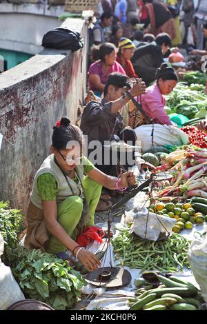 People selling fruits and vegetables at the Lal Bazaar vegetable market in Gangtok, Sikkim, India, on November 04, 2012. (Photo by Creative Touch Imaging Ltd./NurPhoto) Stock Photo