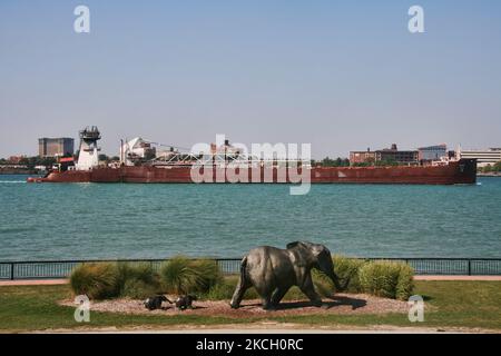 Large bulk carrier ship travels along the Detroit River passing a sculpture of elephants at the Windsor Sculpture Park in Windsor, Ontario, Canada. (Photo by Creative Touch Imaging Ltd./NurPhoto) Stock Photo