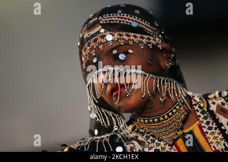 Rajasthani gypsy Kalbelia dancer performs a cobra dance in Marwar, Rajasthan, India. Covered in a veil the dancer spins and twirls like a cobra as she hypnotizes her audience. (Photo by Creative Touch Imaging Ltd./NurPhoto) Stock Photo