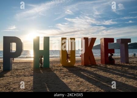 Locals and tourists attend an event organized to mark the opening of Phuket to international tourists on Patong beach. While some travellers have started to arrive on the island after meeting the strict entry requirements, the island is still reeling from the devastation the pandemic has inflicted on the tourism industry. (Photo by Thomas De Cian/NurPhoto) Stock Photo