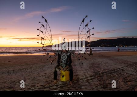 Locals and tourists attend an event organized to mark the opening of Phuket to international tourists on Patong beach. While some travellers have started to arrive on the island after meeting the strict entry requirements, the island is still reeling from the devastation the pandemic has inflicted on the tourism industry. (Photo by Thomas De Cian/NurPhoto) Stock Photo