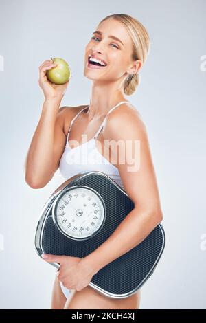 Apple Diet Woman Scale Body Health Self Care Natural Weight Stock Photo by  ©PeopleImages.com 620463918