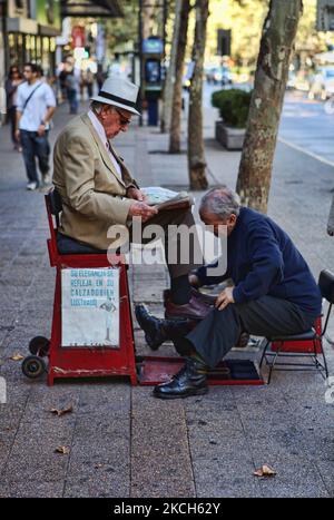 Elderly man gets his shoes shined in downtown Santiago, Chile, on March 08, 2010. (Photo by Creative Touch Imaging Ltd./NurPhoto) Stock Photo