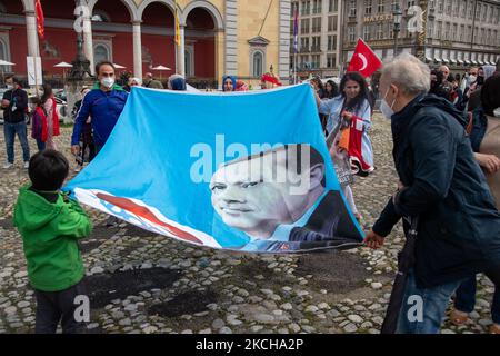 Flag with the face of the Turkish president Recep Tayip Erdogan. A group of supporters of the AK Parti and the turkish president Recep Tayip Erdogan protested on July 15, 2021 in Munich, Germany. They remembered the victims of the failed coup of 2016 and celebrated it as day of democracy. (Photo by Alexander Pohl/NurPhoto) Stock Photo