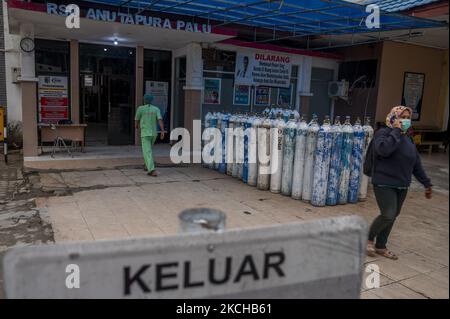 A medical worker walks into the treatment building at the Anutapura General Hospital in Palu, Central Sulawesi, Indonesia on July 17, 2021. The hospital managed by the local government was forced to temporarily close some of its health services to minimize the spread of the corona virus after several health workers were infected. The number of COVID-19 sufferers in Central Sulawesi has increased sharply by more than 200 percent since early July. The local government is using existing buildings to accommodate the spike in cases and meanwhile accelerating the implementation of vaccinations to re Stock Photo