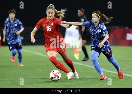 (14)HASEGAWA Yui of Team Japan battles for possession with (16)BECKIE Janine of Team Canada during the Women's First Round Group E match between Japan and Canada during the Tokyo 2020 Olympic Games at Sapporo Dome stadium on July 21, 2021 in Sapporo, Hokkaido, Japan.(Photo by Ayman Aref/NurPhoto) Stock Photo