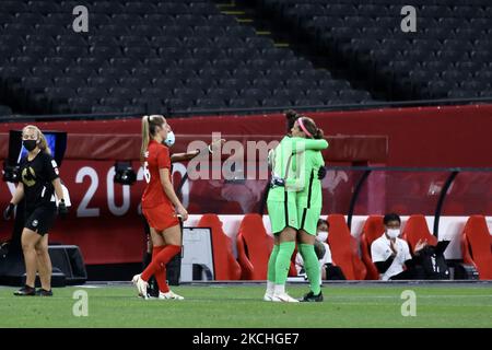 (1) Stephanie Labbe of Team Canada is embraced by teammate (18) Kailen Sheridan as she is substitutedduring the Women's First Round Group E match between Japan and Canada during the Tokyo 2020 Olympic Games at Sapporo Dome stadium on July 21, 2021 in Sapporo, Hokkaido, Japan.(Photo by Ayman Aref/NurPhoto) Stock Photo