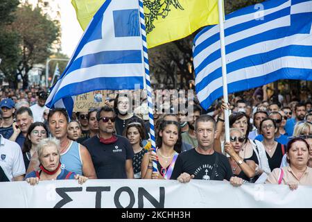 Demonstration Against The Mandatory Vaccine was held in Thessaloniki and Athens in Greece on Wednesday July 21, 2021. One week after the massive protest against the mandatory vaccination the anti-vaxx campaign continues with a big group protesting in the streets of the city of Thessaloniki. The protest was organized via social media by anti-vaccination believers. According to the group more than 40.000 people participated, while the police estimated unofficially slightly around 15.000 people participating in the demonstration. As the Greek government is passing a legislation with mandatory vac Stock Photo