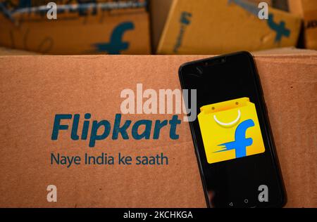 Flipkart logo displayed on a phone screen and Flipkart website displayed on a laptop screen are seen in this illustration photo taken in Tehatta, West Bengal, India on July 24, 2021. Walmart-owned e-commerce firm Flipkart said it has eliminated all single-use plastic packaging used by introducing the most scalable sustainable alternatives eco-friendly materials across its fulfillment centres in India. The Bengaluru-based firm has also ensured it is fully compliant with all EPR (extended producer responsibility) rules and through its network of recyclers; the equivalent quantity of single-use p Stock Photo