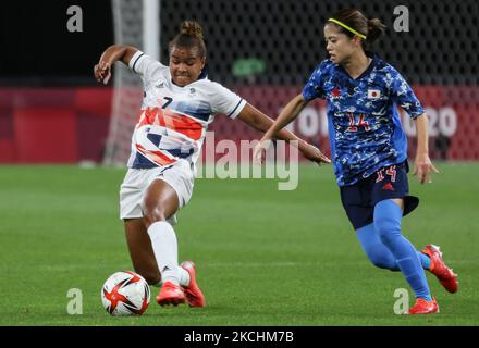 (14) Yui HASEGAWA of Team Japan is challenged by (7) Nikita PARRIS of Team Great Britain during the Women's First Round Group E match between Japan and Great Britain on day one of the Tokyo 2020 Olympic Games at Sapporo Dome Stadium (Photo by Ayman Aref/NurPhoto) Stock Photo