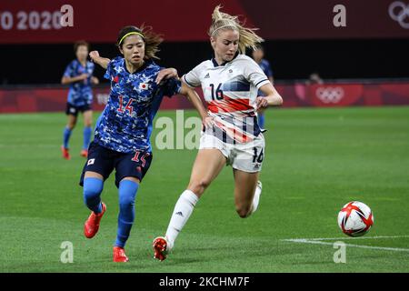 (14) Yui HASEGAWA of Team Japan is challenged by (16) Leah WILLIAMSON of Team Great Britain during the Women's First Round Group E match between Japan and Great Britain on day one of the Tokyo 2020 Olympic Games at Sapporo Dome Stadium (Photo by Ayman Aref/NurPhoto) Stock Photo