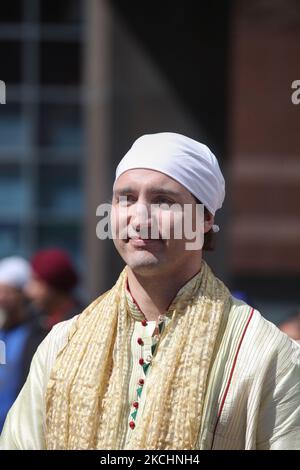 Federal Liberal opposition leader Justin Trudeau watches the colourful procession during the Khalsa Day Parade in Toronto, Ontario, Canada, on April 27, 2014. Close to a hundred thousand Sikhs filled the streets of downtown Toronto to take part in the Khalsa Day Parade to celebrate Vaisakhi and the 315th anniversary of the Khalsa. (Photo by Creative Touch Imaging Ltd./NurPhoto) Stock Photo