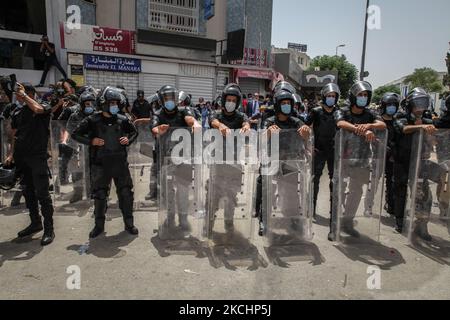 Riot police members seen during a demonstration held near the Tunisian parliament, in the city of Bardo, in the capital Tunis, Tunisia on July 25, 2021 to call for the fall of the regime, the dissolution of the parliament and to demand Hichem Mechichi’s government step down. (Photo by Chedly Ben Ibrahim/NurPhoto) Stock Photo