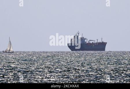 The port of Barcelona registers a historical record of commercial ship traffic, with 1.8 million containers, 31% more than in 2020, badly hit by the Coronavirus pandemic. The record is also 4.2% higher than the same period in 2019. In the photo, a container ship is heading towards the unloading area, in Barcelona on 28th July 2021. -- (Photo by Urbanandsport/NurPhoto) Stock Photo