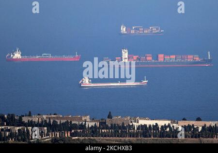 The port of Barcelona registers a historical record of commercial ship traffic, with 1.8 million containers, 31% more than in 2020, badly hit by the Coronavirus pandemic. The record is also 4.2% higher than the same period in 2019. In the photo, container ships anchored in front of the port, in Barcelona on 28th July 2021. -- (Photo by Urbanandsport/NurPhoto) Stock Photo