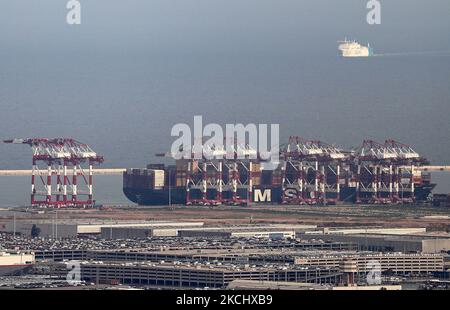 The port of Barcelona registers a historical record of commercial ship traffic, with 1.8 million containers, 31% more than in 2020, badly hit by the Coronavirus pandemic. The record is also 4.2% higher than the same period in 2019. In the photo, cranes unloading containers from a ship, in Barcelona on 28th July 2021. -- (Photo by Urbanandsport/NurPhoto) Stock Photo