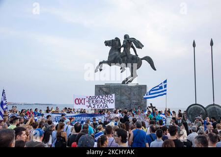 Speech in front of the statue of Alexander the Great when the demo finished. Hundreds of people, less than the big previous rally, are seen at the Demonstration Against The Mandatory Vaccine that was held in Thessaloniki in Greece on Wednesday July 28, 2021. One week after the massive protest against the mandatory vaccination the anti-vaxx campaign continues with a big group protesting in the streets of the city of Thessaloniki. The protest was organized via social media by anti-vaccination believers. According to the group more than 5000 people participated, while the police estimated unoffic Stock Photo