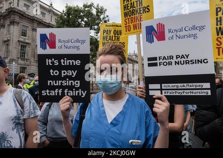 LONDON, UNITED KINGDOM - JULY 30, 2021: NHS staff and their supporters gather outside Downing Street during a protest demanding a fair pay increase for health workers on July 30, 2021 in London, England. The government has announced a 3% pay rise for the NHS staff in England and Wales following NHS Pay Review Body’s recommendations, however the campaigners argue the offer doesn't meet the inflation rate and undervalues healthcare workers who experienced unprecedented pressure during the coronavirus pandemic. (Photo by WIktor Szymanowicz/NurPhoto)